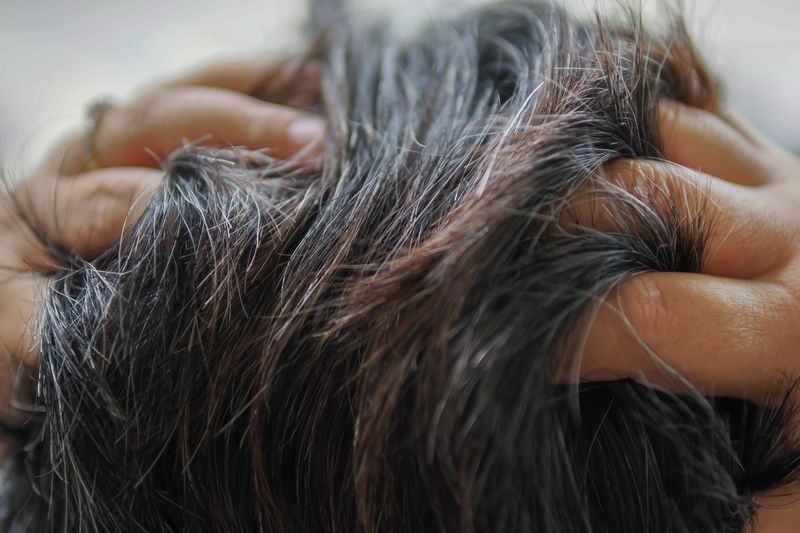 close up of silver and dark gray hair