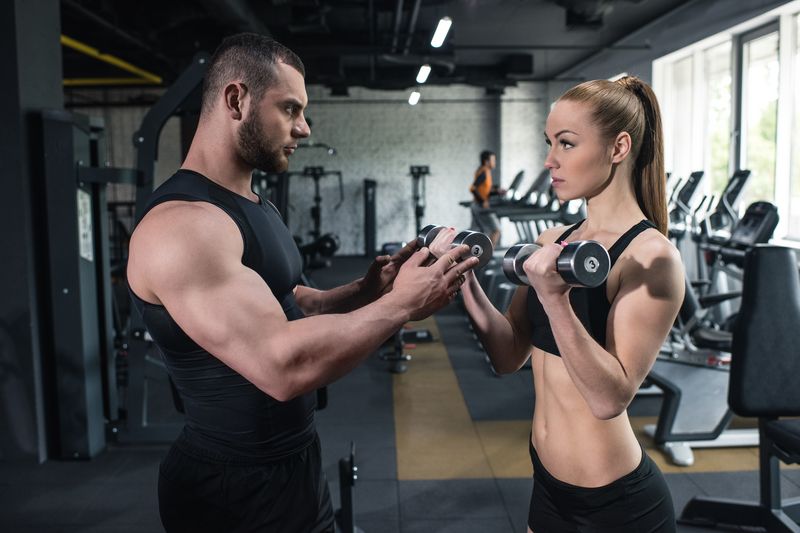 young caucasian couple of athletes training with d